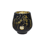 Black candle holder with gold skeleton and pumpkin design on a white background