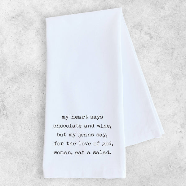 White towel with black text on a light gray background