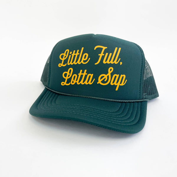 A green trucker hat with the text 'Little Full, Lotta Sap' printed in yellow.