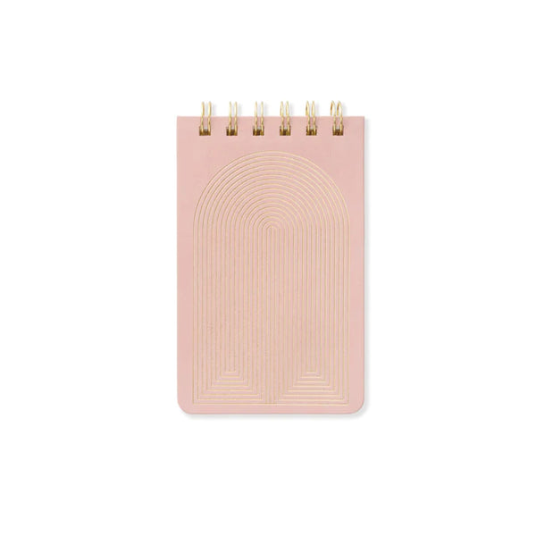 Pink notebook with gold arch design on a white background