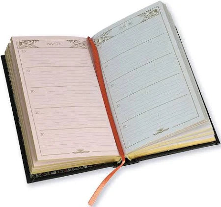 Open planner with two different pages on a white background