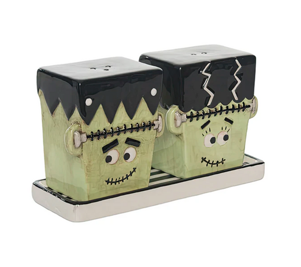 Frankenstein-themed salt and pepper shakers on a white background
