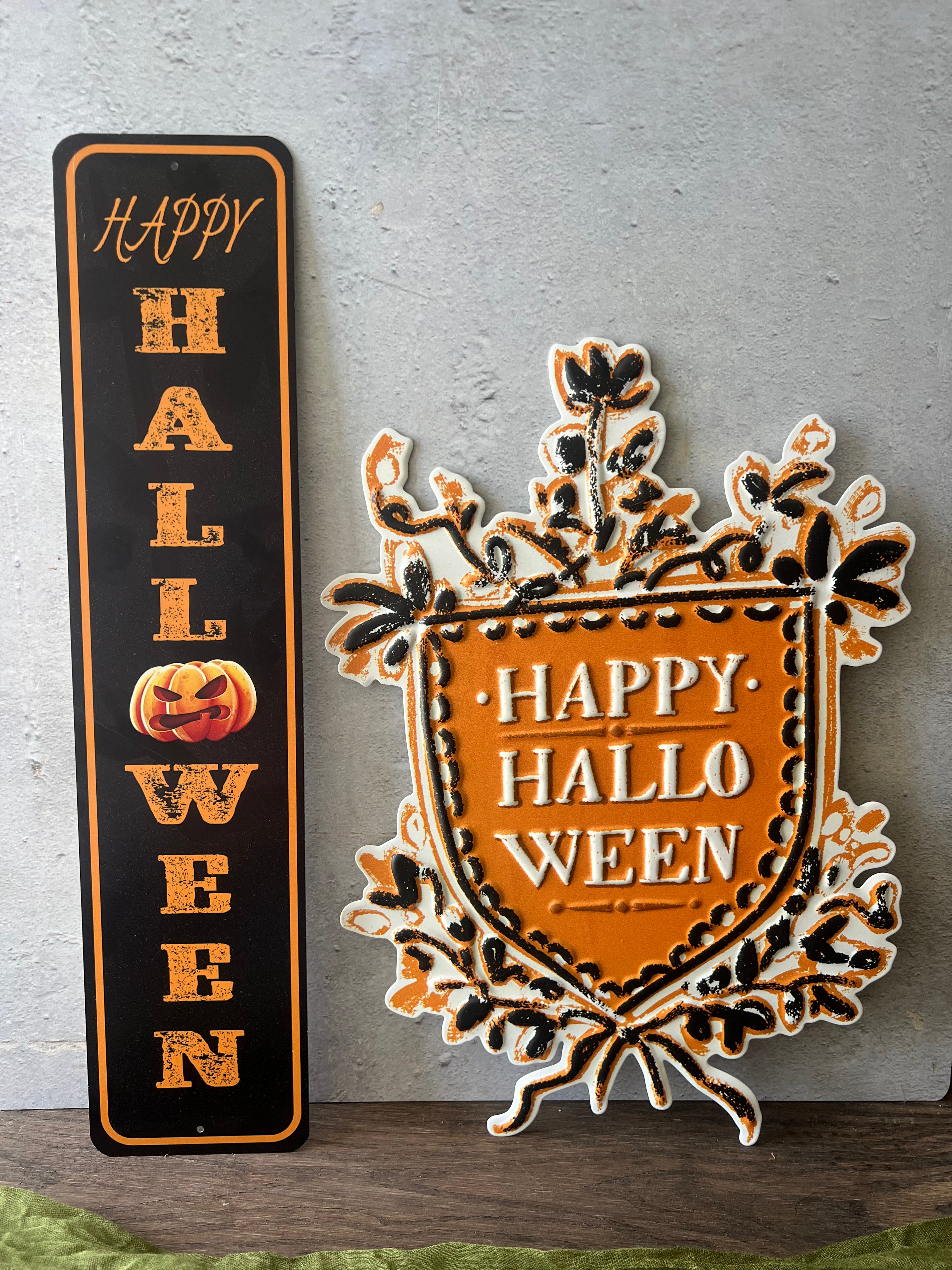 EMBOSSED METAL WALL DECOR W/ HALLOWEEN SAYING