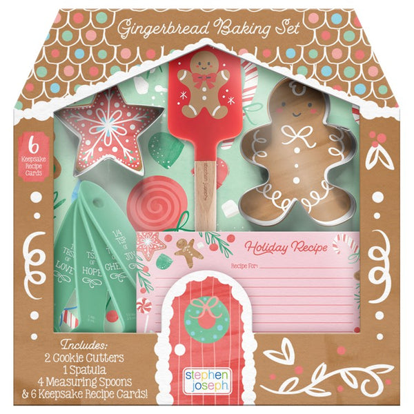A gingerbread baking set packaging with various baking tools and ingredients like cookie cutters, a spatula, measuring spoons, and recipe cards, designed for children.