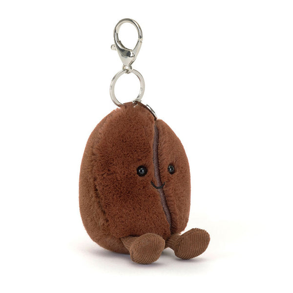 Plush keychain shaped like a coffee bean on a white background