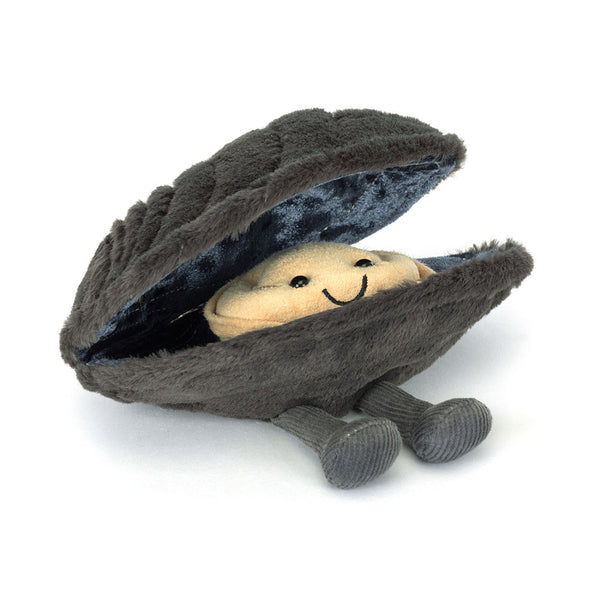 Plush toy inside a shell with a smiling face on a white background