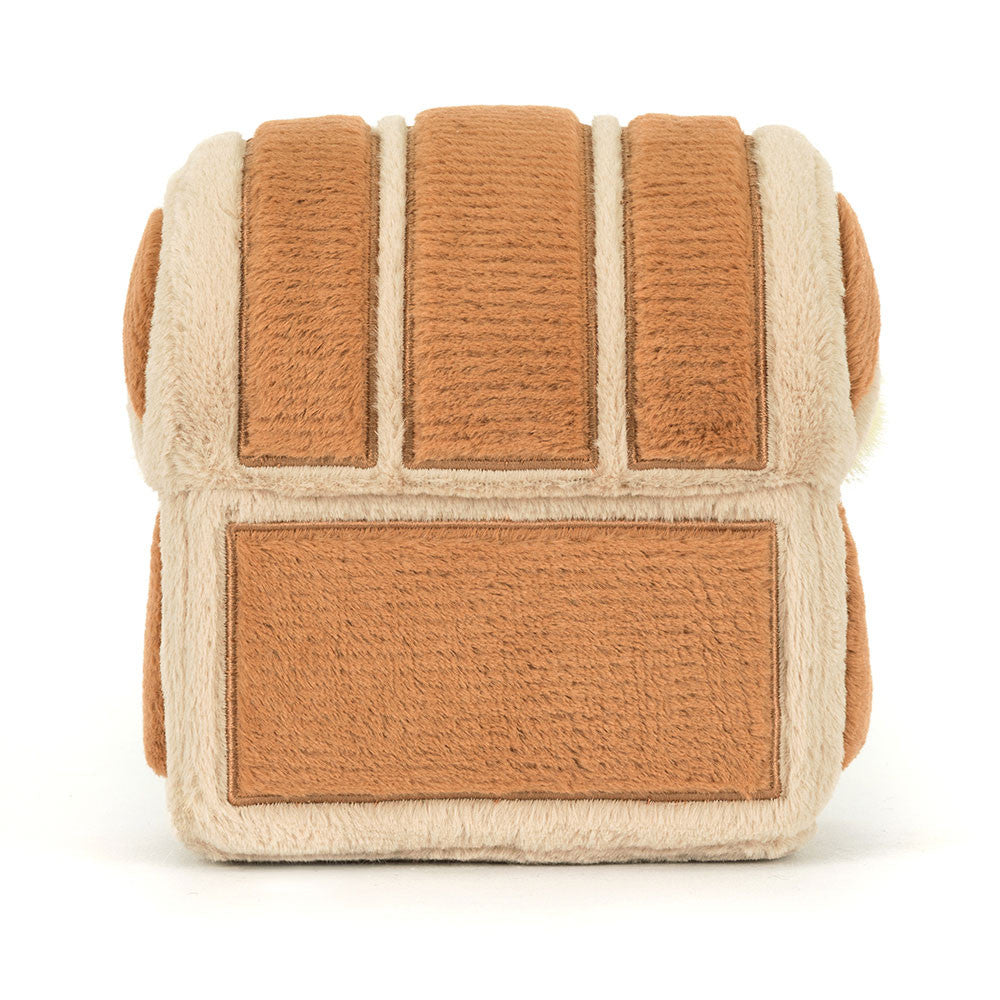 Textured cube-shaped toy with brown and beige pattern on a white background