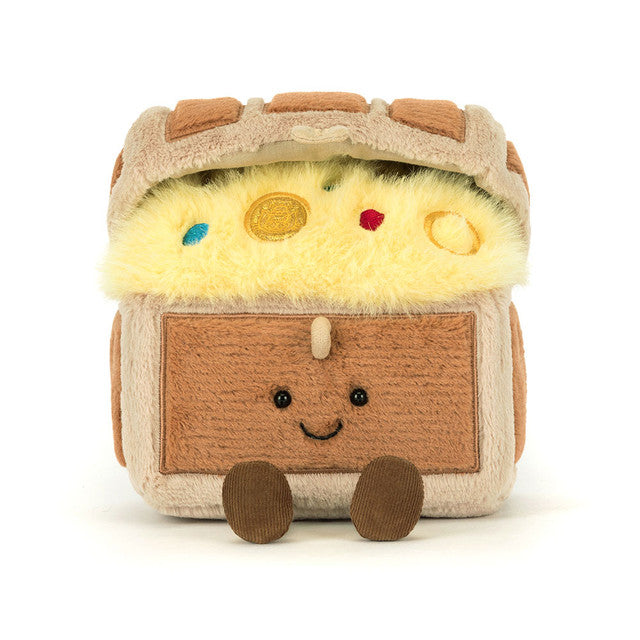 Plush toy resembling a camper van with a smiling face on a white background