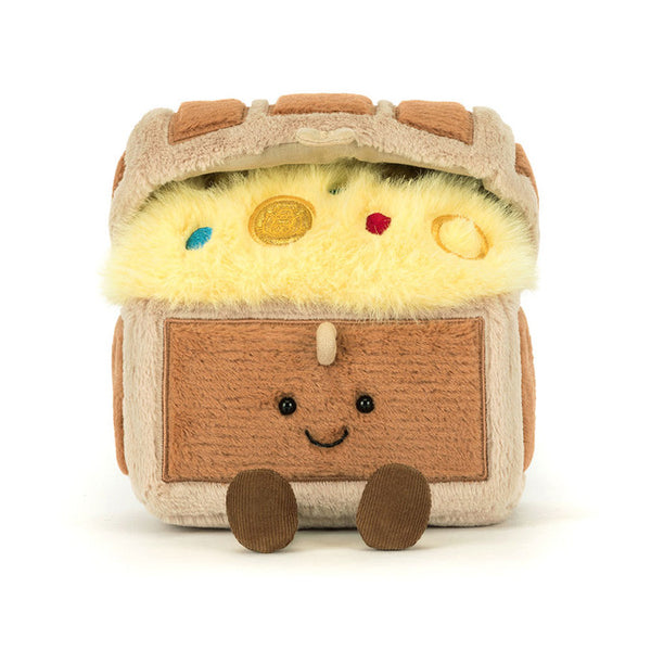 Plush toy resembling a camper van with a smiling face on a white background