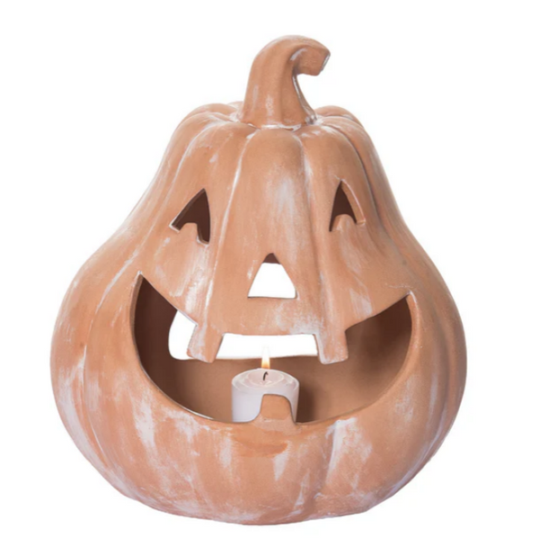 A terracotta candle holder shaped like a pumpkin with a candle inside, primarily in brown color.