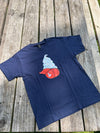 Navy blue t-shirt with a graphic design on a wooden surface