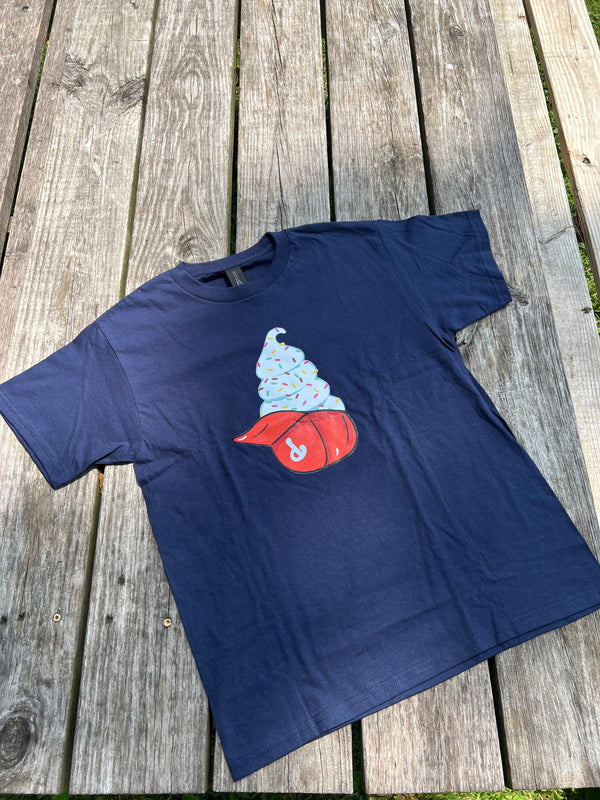 Navy blue t-shirt with a graphic design on a wooden surface