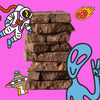 Stack of chocolate with colorful illustrations of an astronaut, alien, and rocket ship on a pink background
