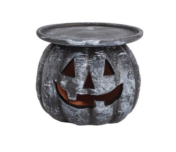 Halloween-themed candle holder with jack-o'-lantern design on a white background