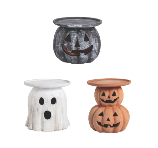 Three Halloween-themed wax warmers on a white background