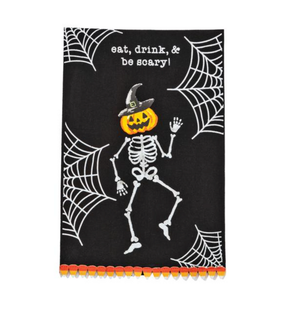 Halloween-themed towel with skeleton and pumpkin design on a black background with spider webs.