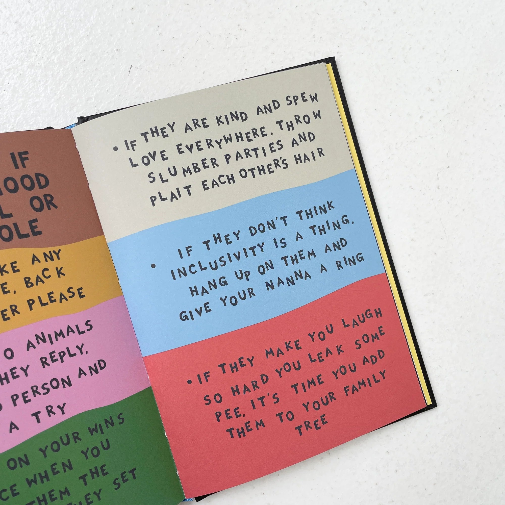 Open book with colorful text on a white background