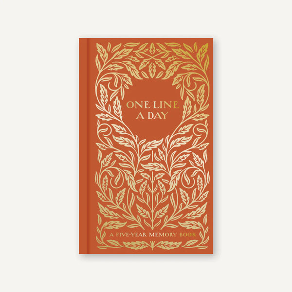 Book with gold leaf design and 'One Line A Day' text on a red background
