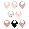 Set of nine baby bibs with various patterns on a white background