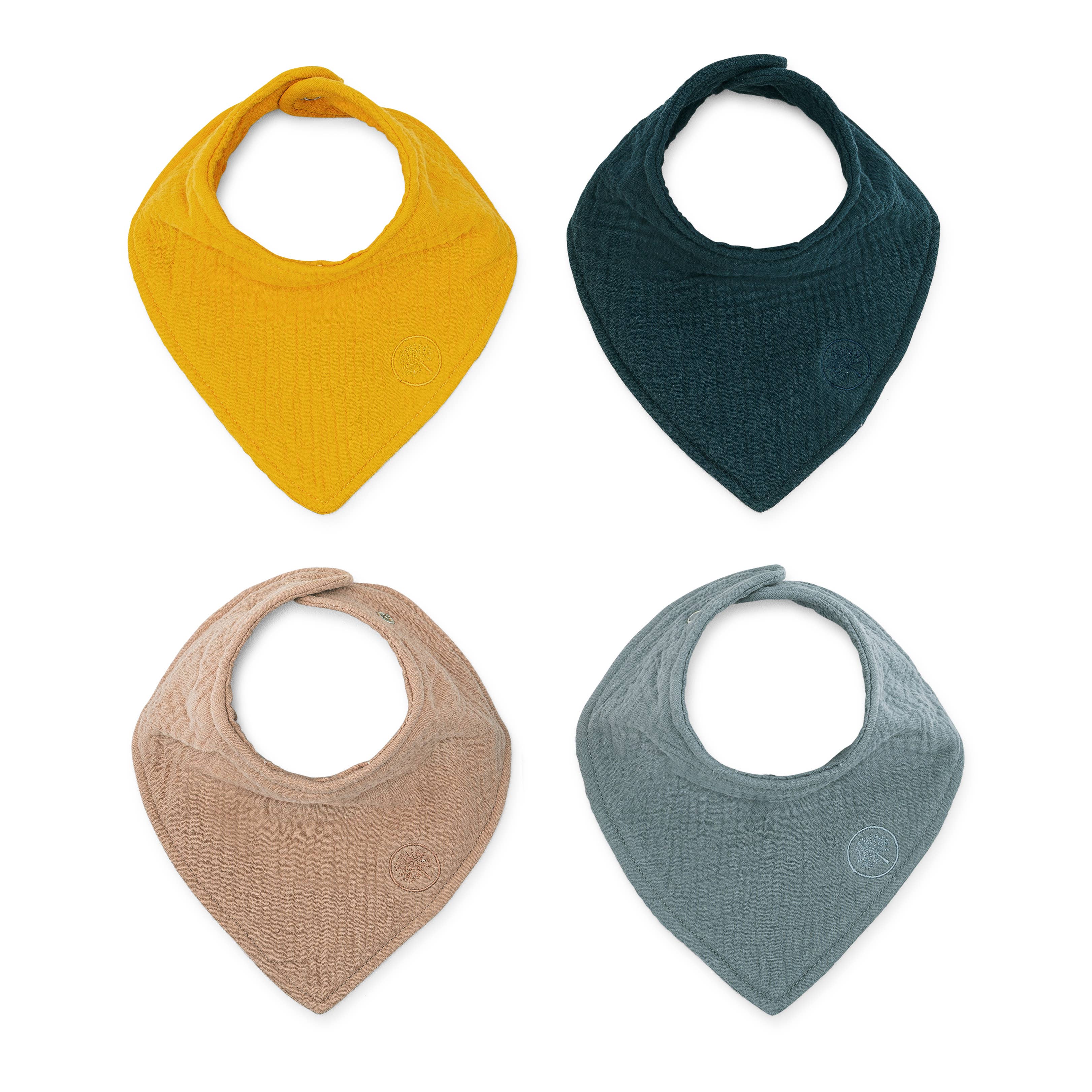 Four colorful baby bibs on a white background