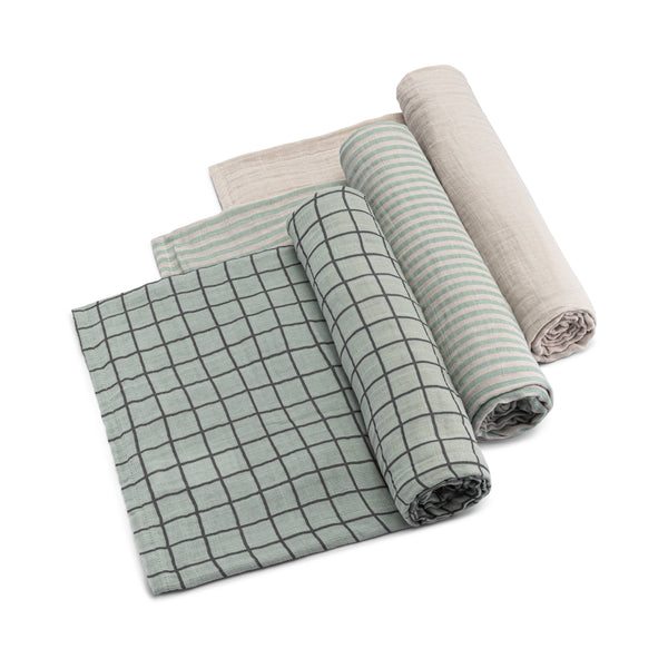 Set of rolled-up fabric swatches with grid patterns on a white background