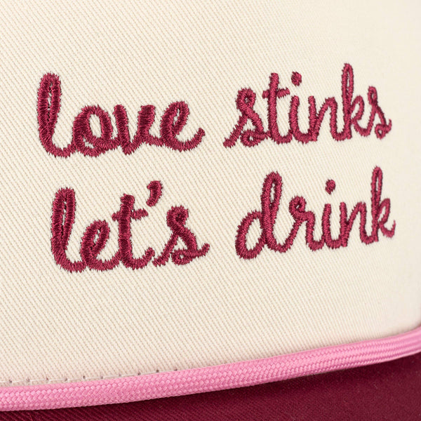 LOVE STINKS LET'S DRINK TRUCKER HAT