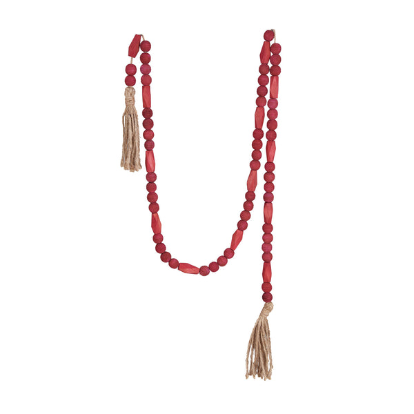 A burgundy Paulownia wood bead garland with jute tassels.