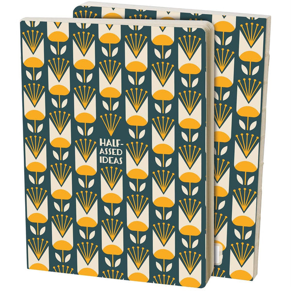 Two notebooks with a floral pattern and text 'Half Assed Ideas' on a white background
