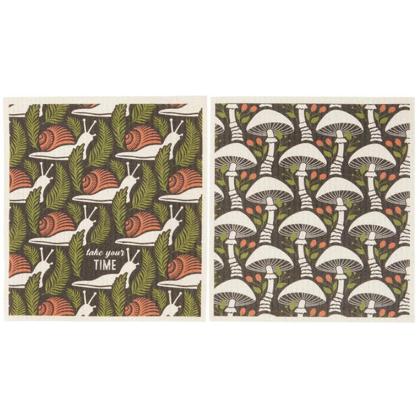 Two patterned towels with snail and mushroom designs on a white background