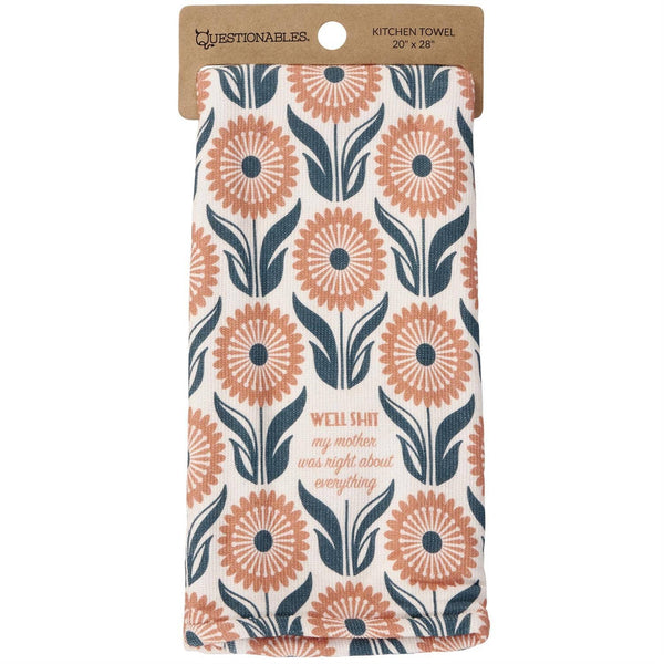 Kitchen towel with floral pattern and text on a white background