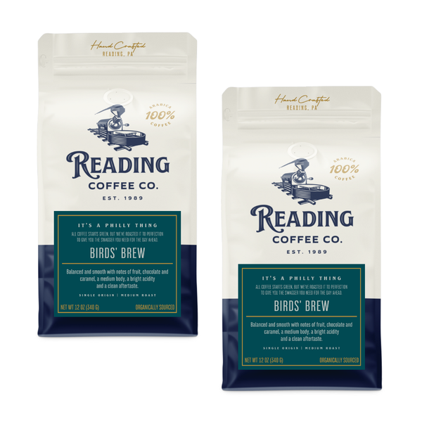 Two packages of Reading Coffee Co. Birds' Brew on a white background