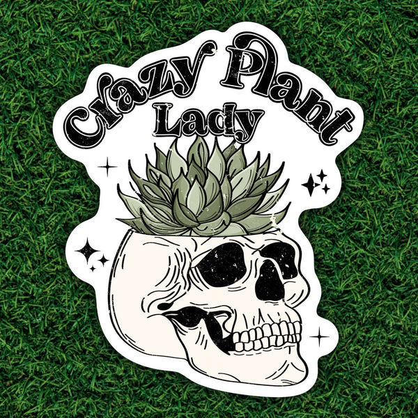 Sticker with skull and succulent design and 'Crazy Plant Lady' text on grass background