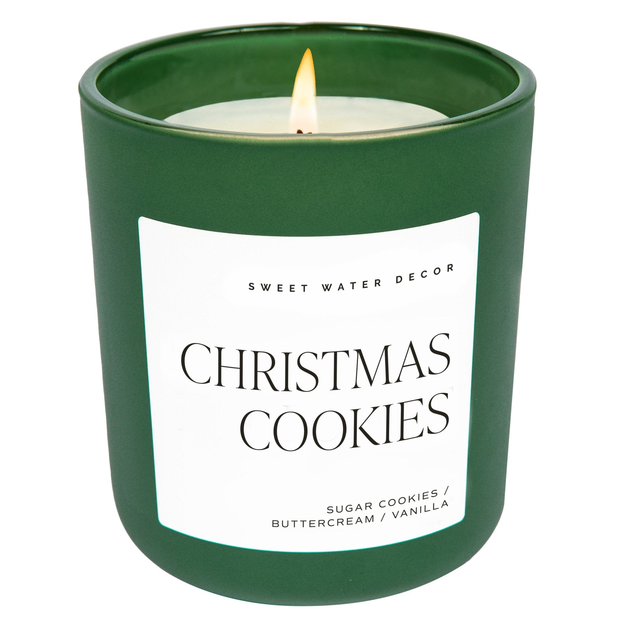 A green matte jar candle labeled 'Christmas Cookies' with white text, from the brand Sweet Water Decor.