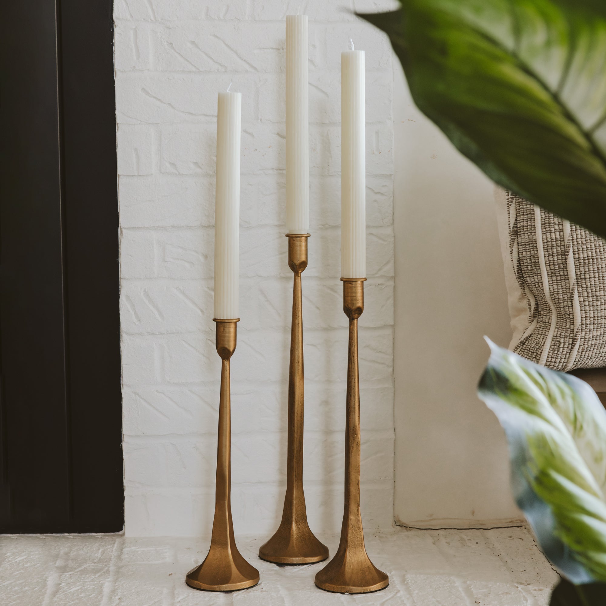 GOLD CAST IRON TAPER CANDLE HOLDERS