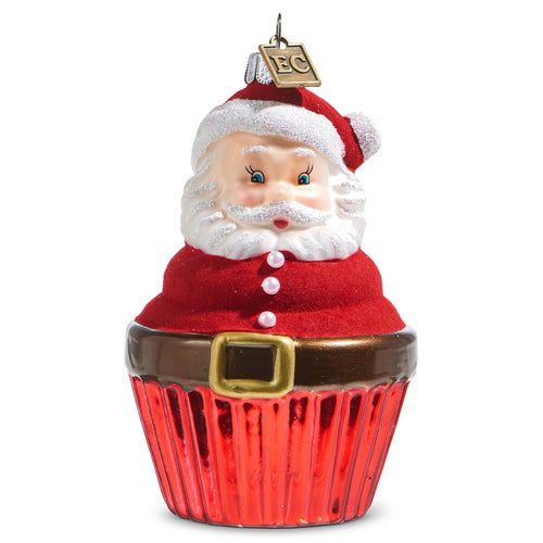 A glass ornament depicting a Santa cupcake with a red suit and white trim, designed by Eric Cortina.