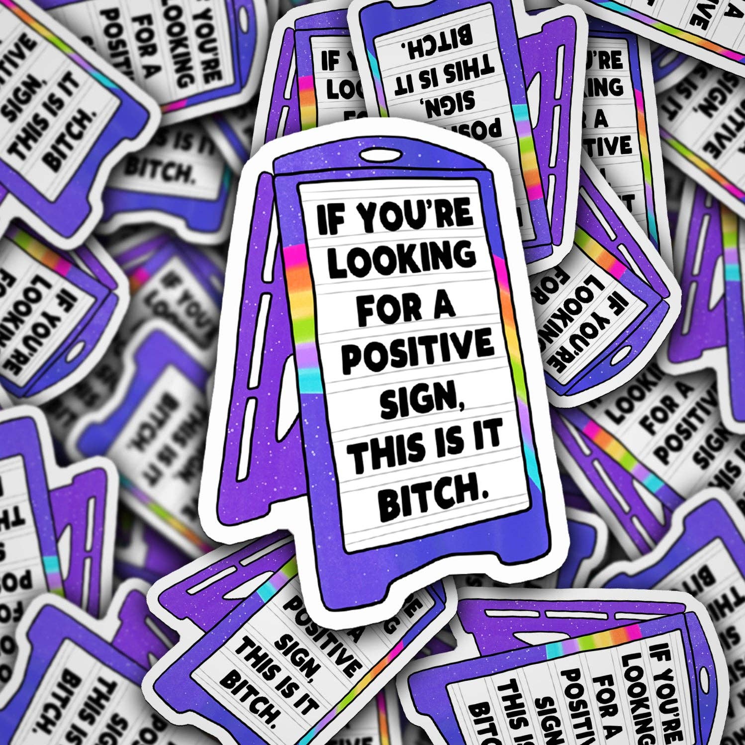 Stickers with a humorous message on a pile of similar stickers.