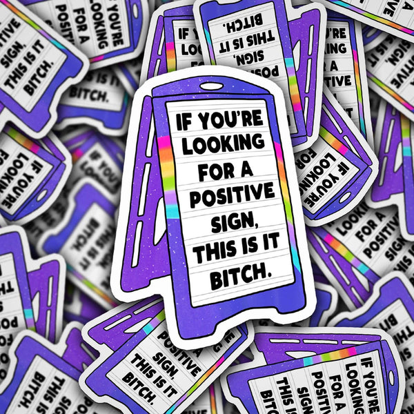 Stickers with a humorous message on a pile of similar stickers.
