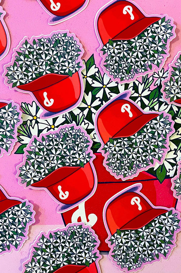Red caps with question marks and green plants on a pink background