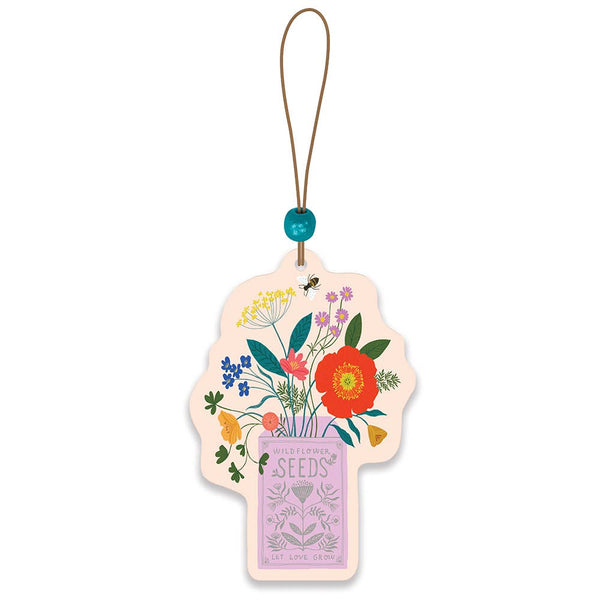 Decorative seed packet with floral design on a white background