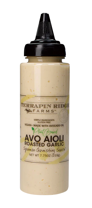 A bottle of Terrapin Ridge Farms Roasted Garlic Avo Aioli garnishing sauce.