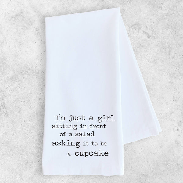 White towel with black text on a light gray background