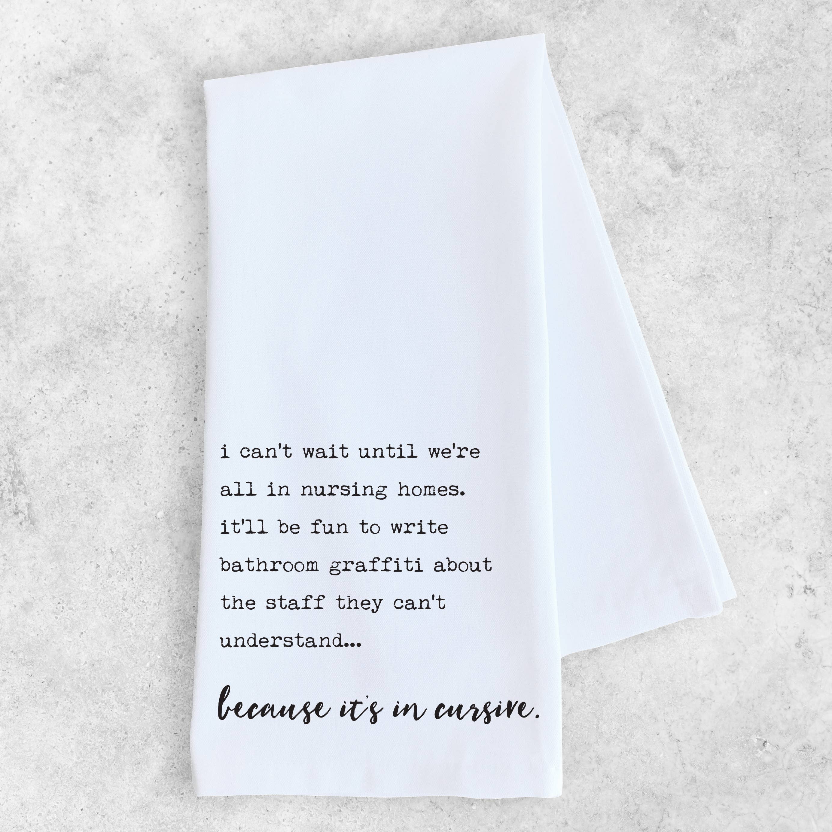 White towel with black text on a light gray background