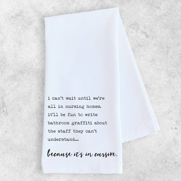 White towel with black text on a light gray background