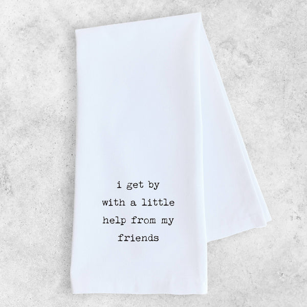 White towel with black text on a light gray background