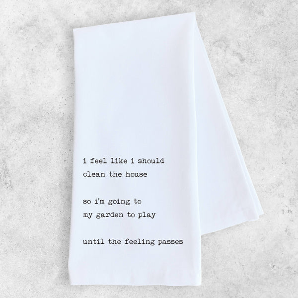 White towel with black text on a light gray background