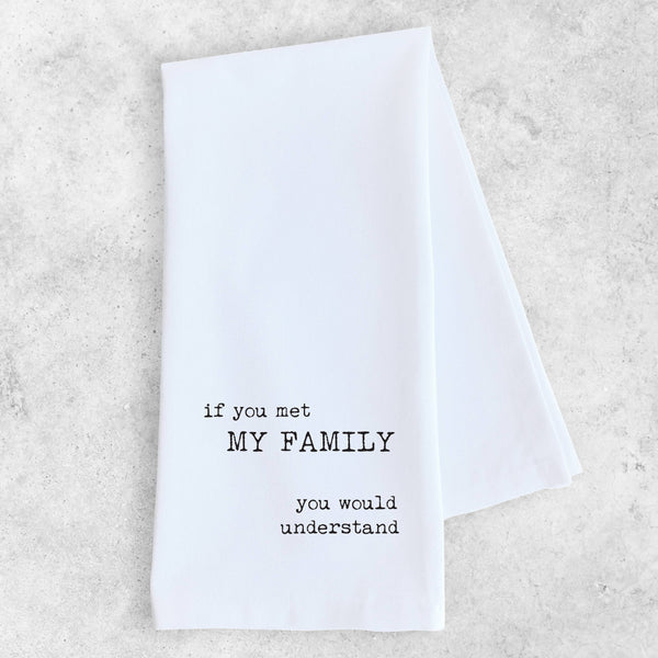 White towel with black text on a light gray background