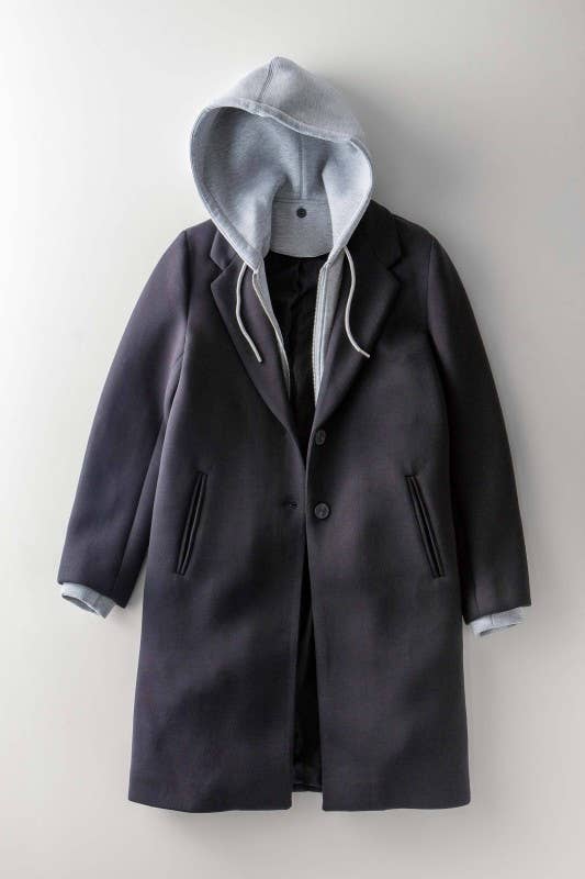 Dark gray coat with a hood on a light gray background