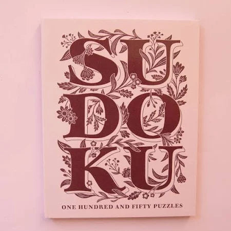 Sudoku book cover with decorative text on a pink background