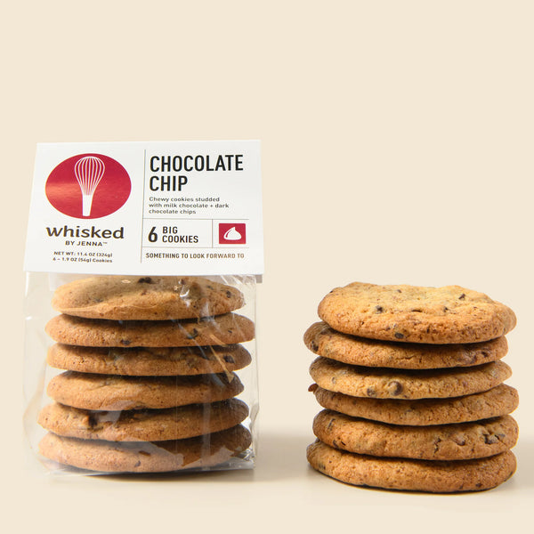 Stack of chocolate chip cookies with a clear package labeled 'Whisked by Jenna' on a beige background.