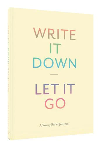 Journal with 'Write It Down, Let It Go' text on a light yellow background